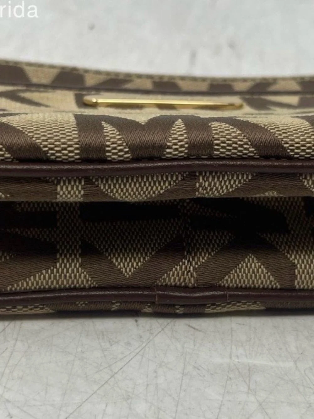 Michael Kors Brown and Tan Signature MK Wristlet with Gold Plate